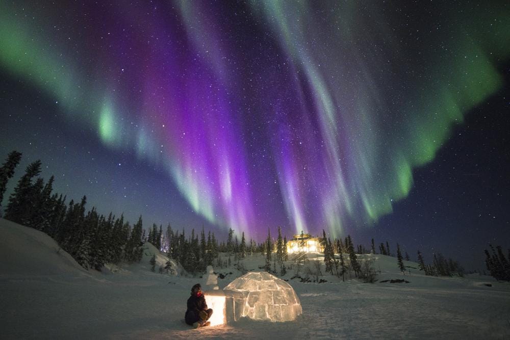 A stunning Aurora by the igloo.
