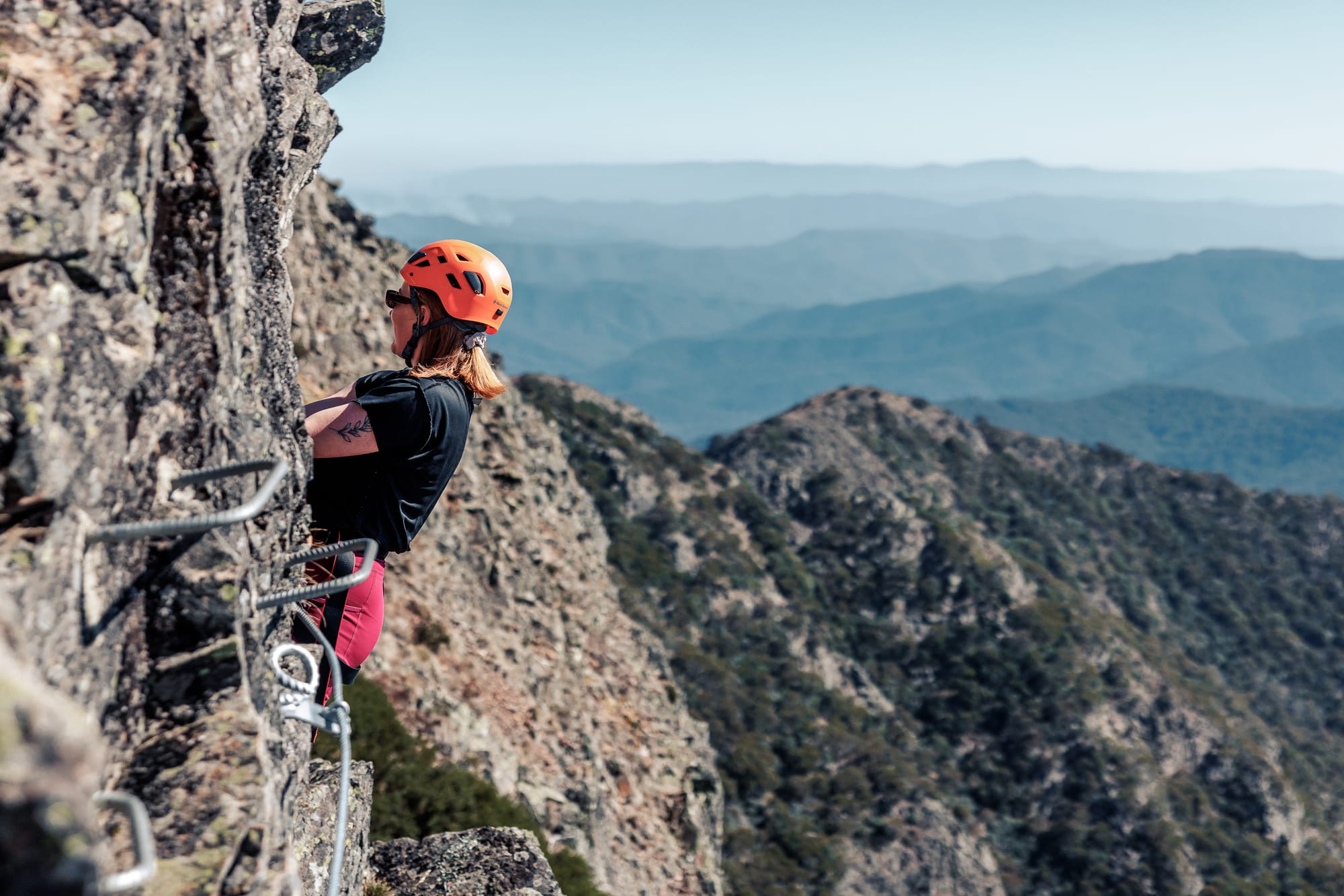 ON TOP OF THE WORLD: The view is stunning from the summit and looking down from the cliff face.